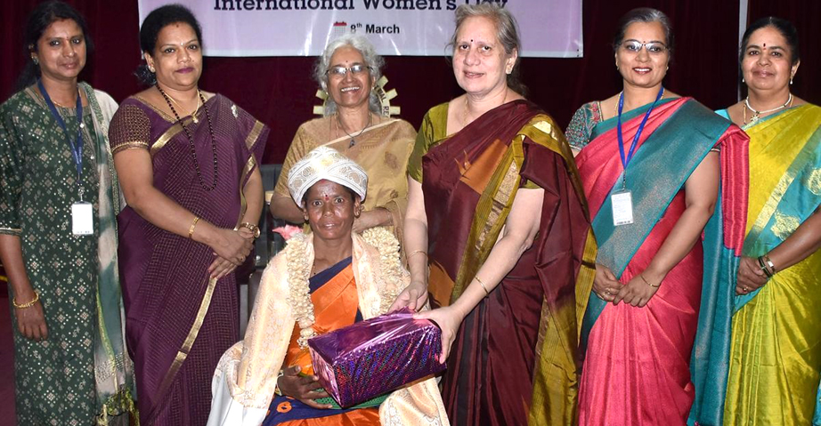 Women scientists and guests on stage at the International Women's Day celebration at CSIR-CFTRI